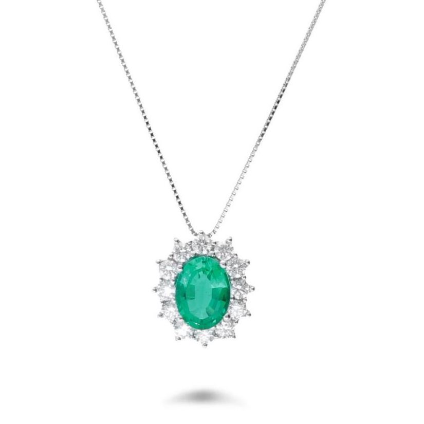 An emerald pendant necklace with a diamond halo on a white background